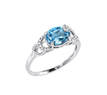 Lady´s ring in white gold of 585 assay value with diamonds and blue topaz 