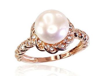 Lady´s ring in red gold of 585 assay value with zirconia, pearls 19,0 mm